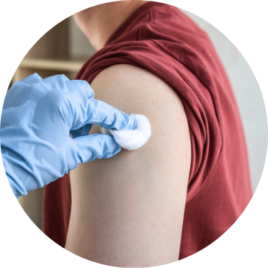 Man receiving vaccine from healthcare worker.