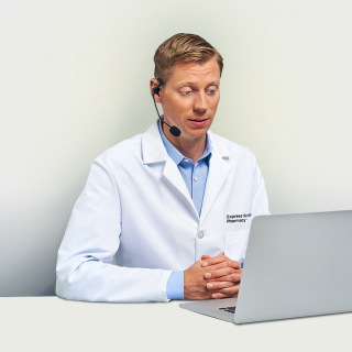 An Express Scripts® Pharmacy pharmacist speaks with a patient on the phone.